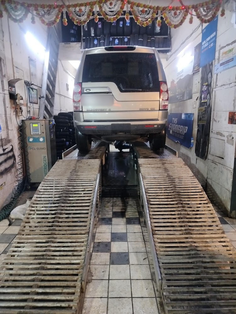 SUV on the wheel alignment ramps