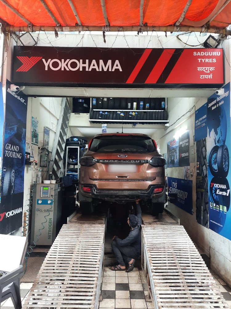 Car on the alignment ramps under the Yokohama sign