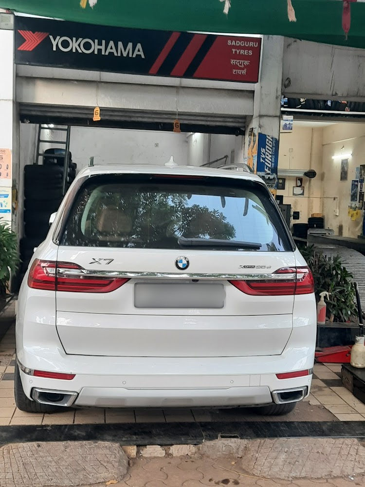 White BMW SUV ready for tyre service