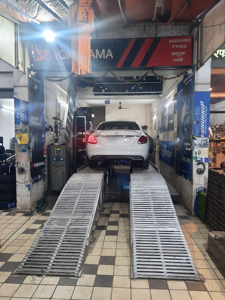 Car lifted on the alignment ramps